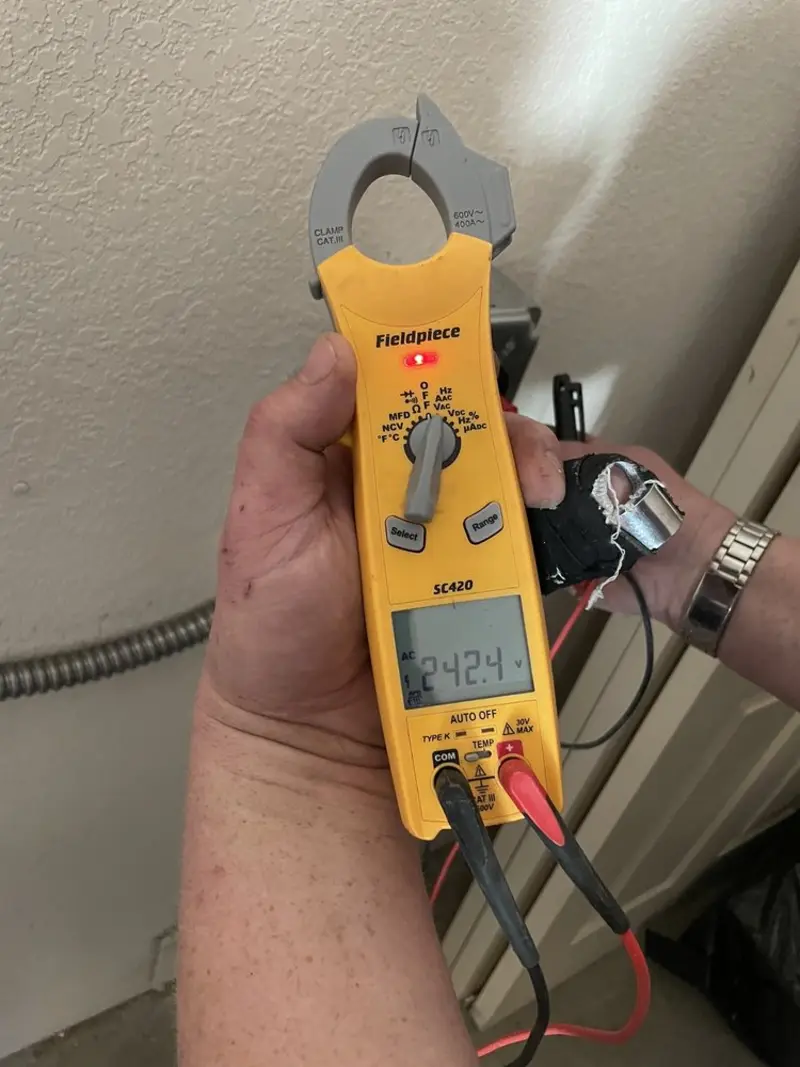 Voltage testing with clamp meter during Aluminum Wiring Replacement in Iowa
